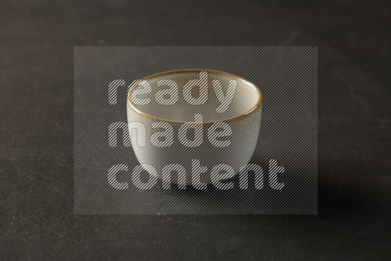 multi color round bowl on grey textured countertop