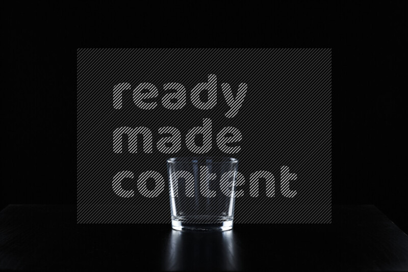 Glassware with rim light against black background