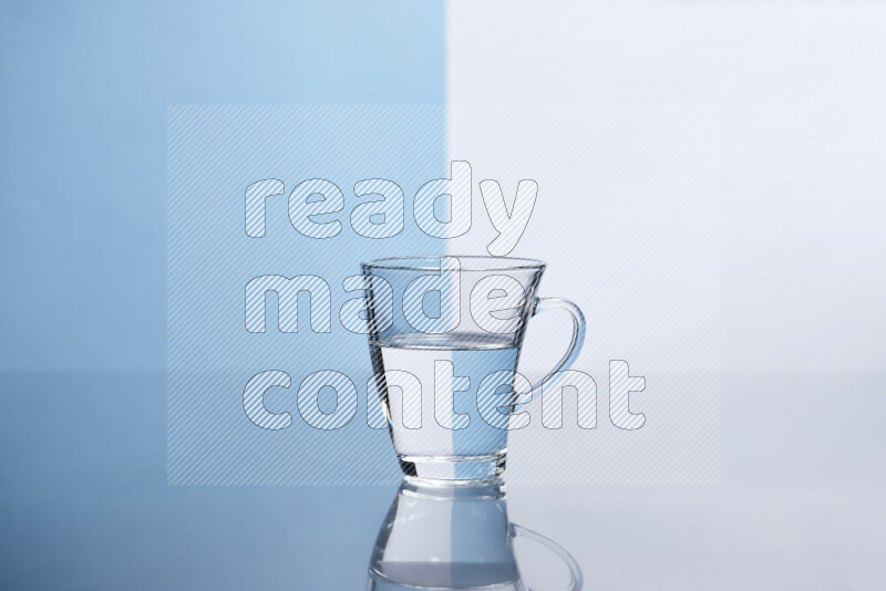 The image features a clear glassware filled with water, set against white and light blue background