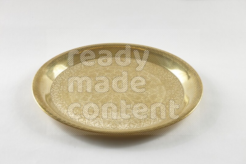 A golden metal tray on white background