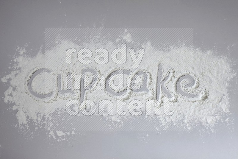 A word written with powder on grey background