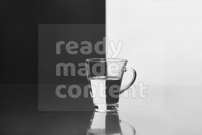 The image features a clear glassware filled with water, set against white and black background