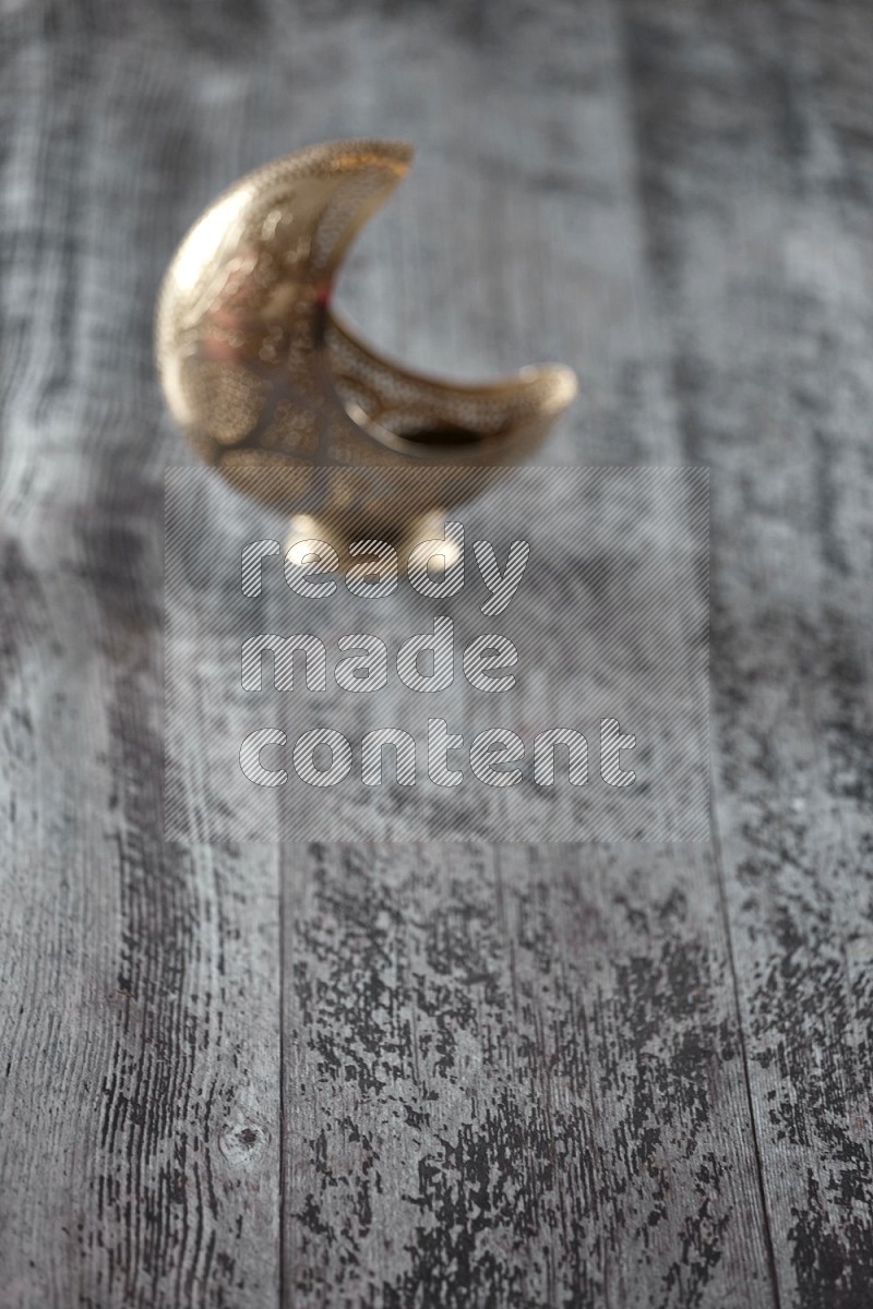 An out of focus lantern on wooden background