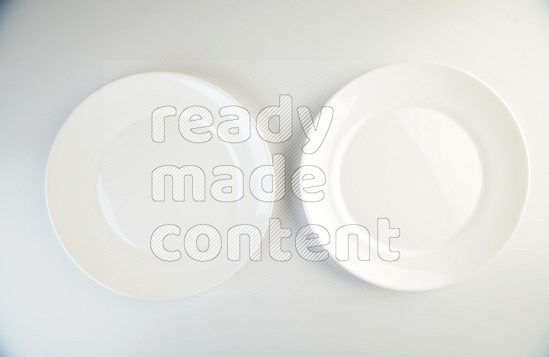 white and black plates on white background