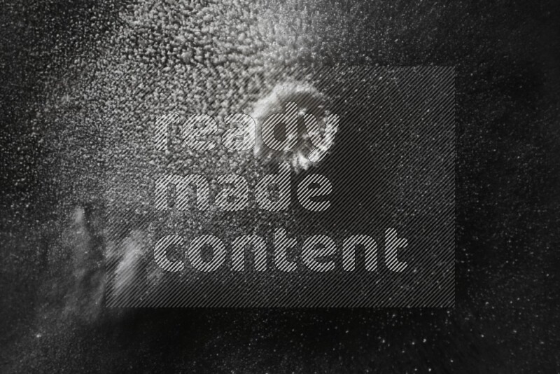 White powder explosion on black background
