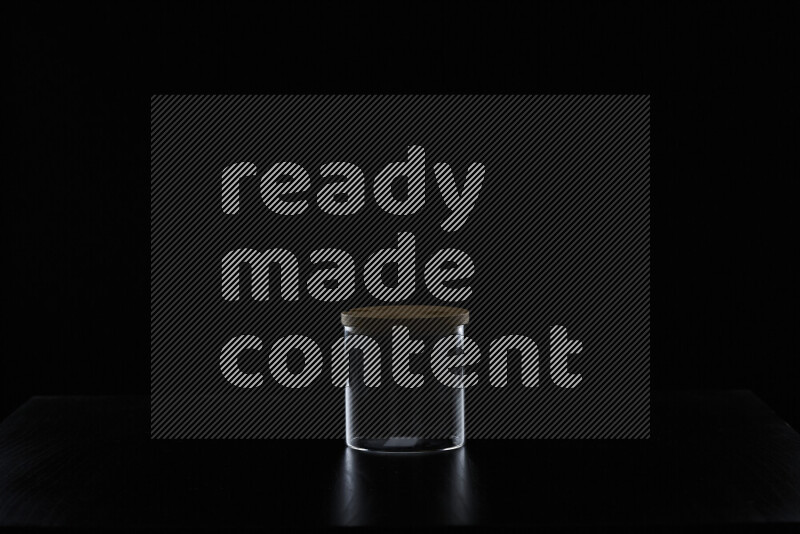 Glassware with rim light against black background