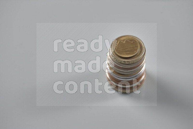 Random old coins on grey background