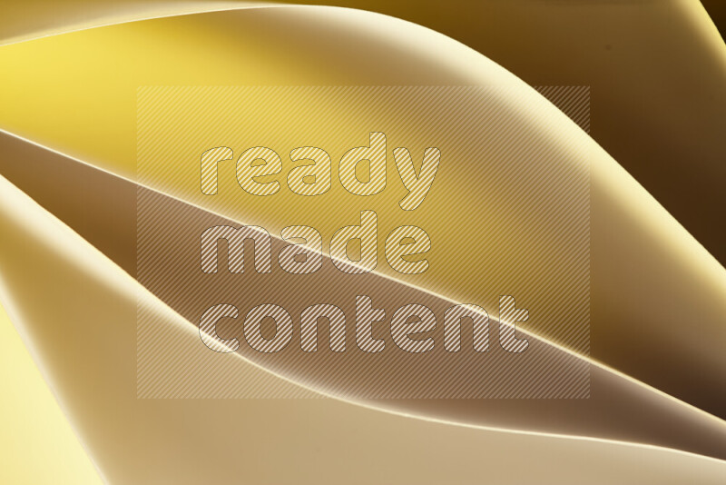 This image showcases an abstract paper art composition with paper curves in gold gradients created by colored light