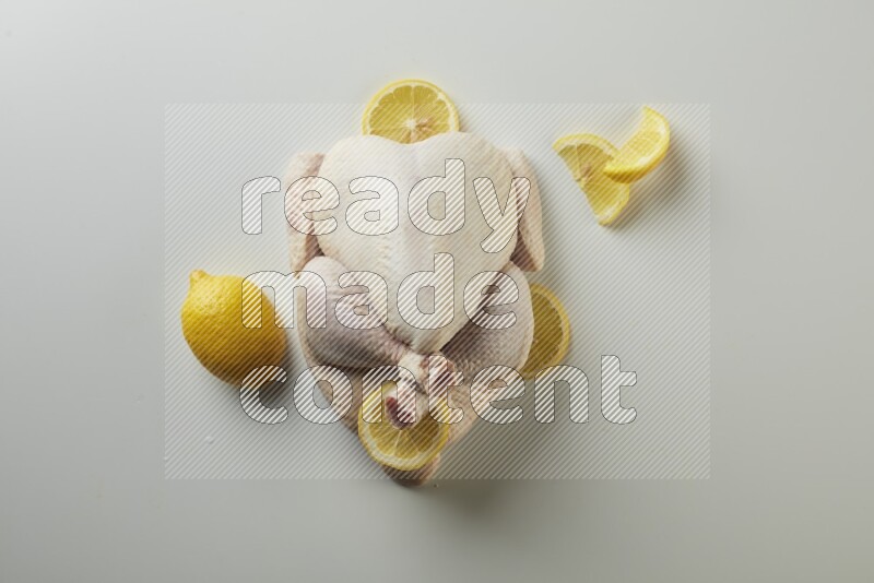 Whole fresh chicken direct on a white background