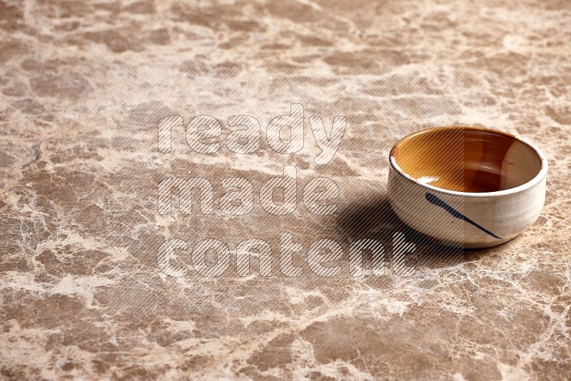 Multicolored Pottery Bowl on Beige Marble Flooring