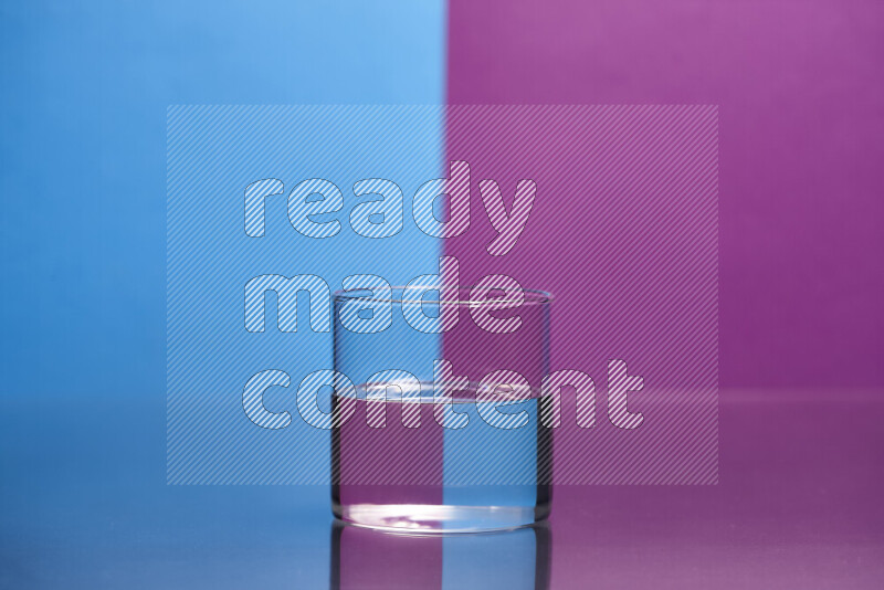 The image features a clear glassware filled with water, set against blue and purple background