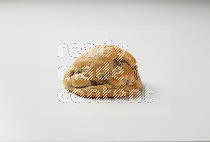 a chocolate chip cookie on a white background