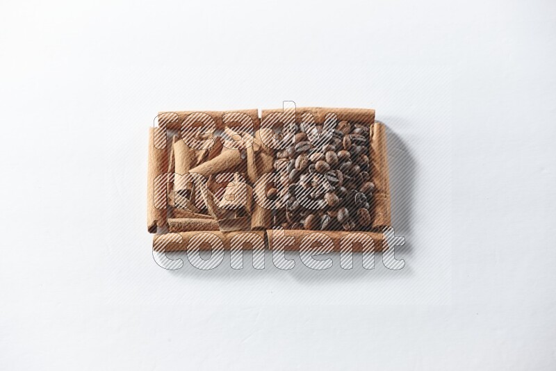2 squares of cinnamon sticks full of coffee beans and cinnamon on white flooring