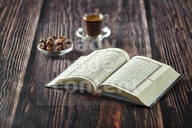 Quran with dates, prayer beads and different drinks on wooden background