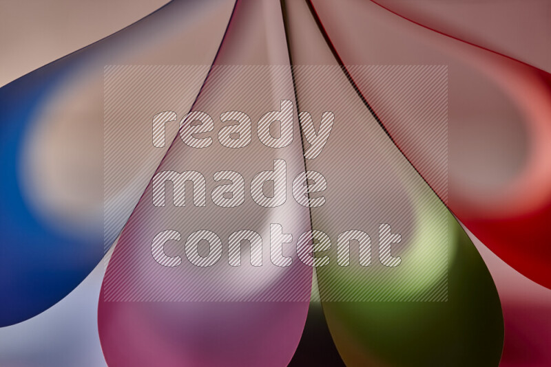 An abstract art piece displaying smooth curves in colorful gradients created by colored light