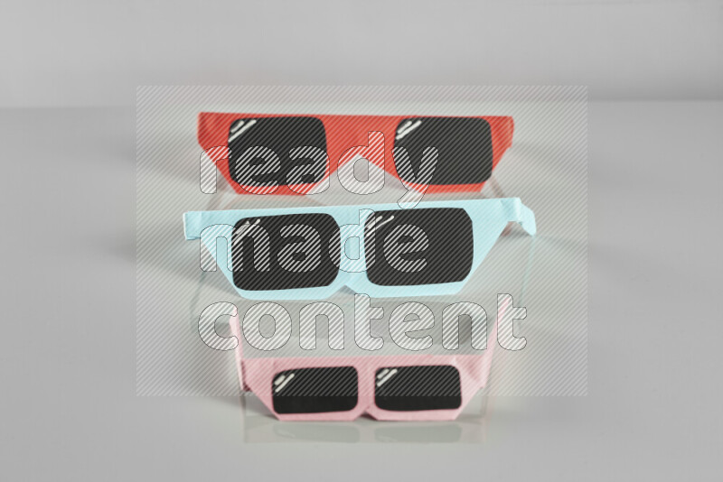 Origami sun glasses on grey background