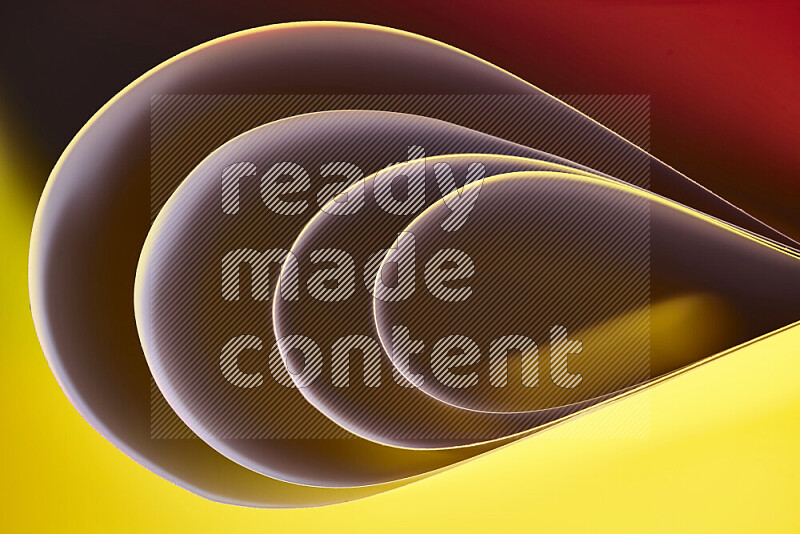 An abstract art of paper folded into smooth curves in yellow, brown and red gradients