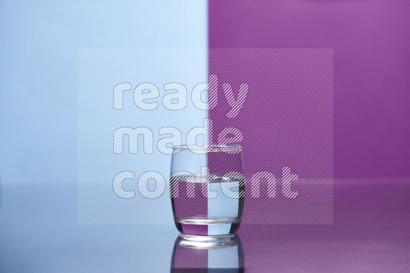 The image features a clear glassware filled with water, set against light blue and purple background