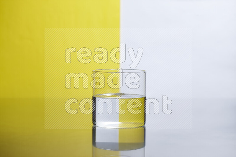 The image features a clear glassware filled with water, set against white and yellow background