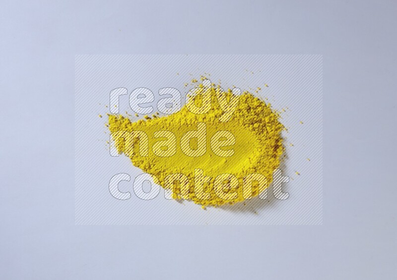 Yellow powder strokes on white background