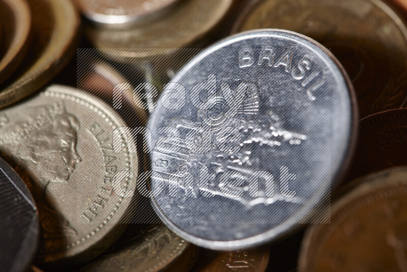 A close-ups of random old coins on black background