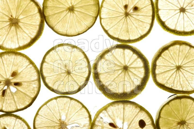 Lemon slices on illuminated white background