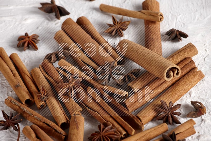 cinnamon sticks with star anise on white background
