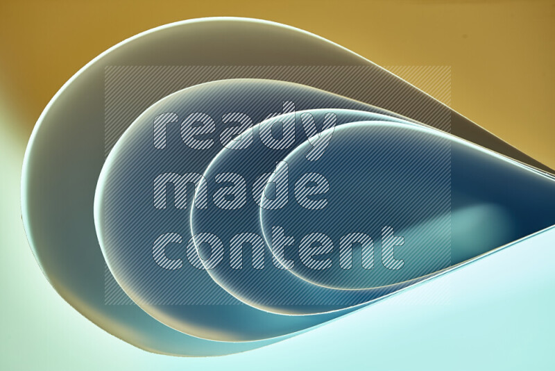 فن تجريدي لورق مطوي على شكل منحنيات ناعمة بتدرجات اللون الأخضر والأصفر