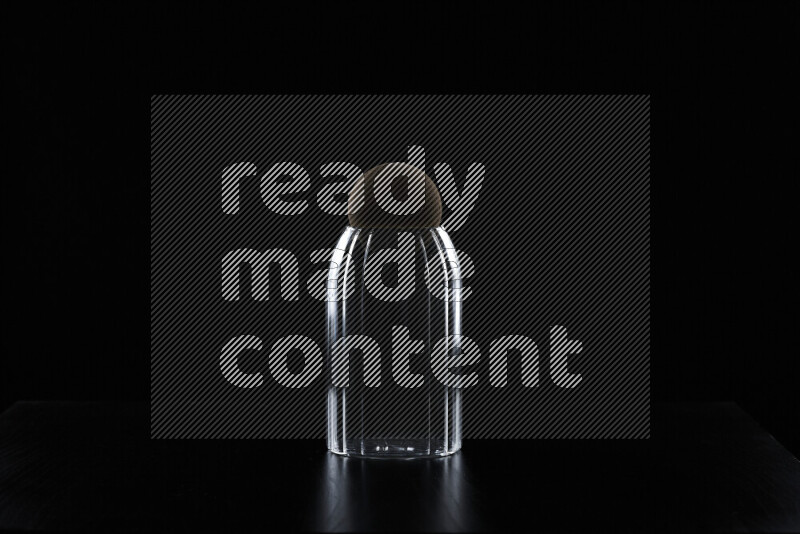 Glassware with rim light against black background