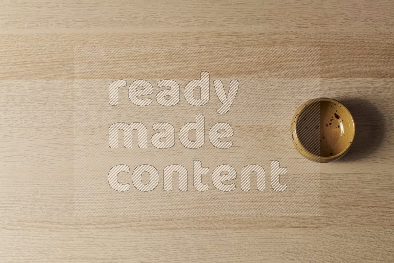 Top View Shot Of A Multicolored Pottery Bowl on Oak Wooden Flooring