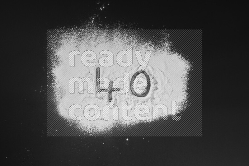 Numbers written with powder on black background