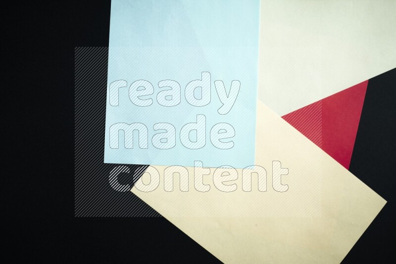 Multicolored paper sheet on black background