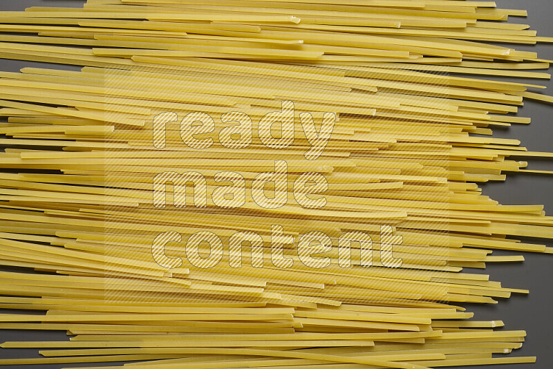 Linguini pasta on grey background