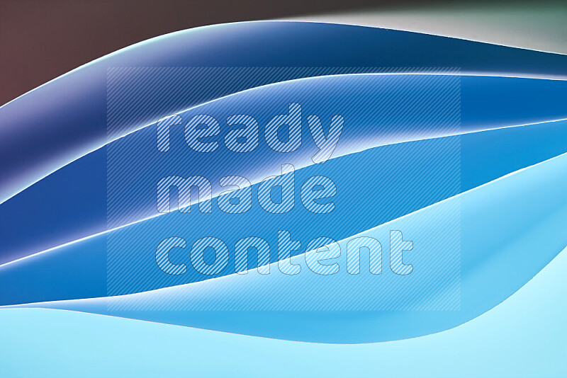 This image showcases an abstract paper art composition with paper curves in blue gradients created by colored light
