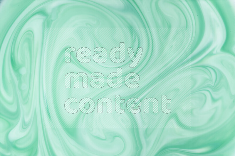 A close-up of abstract swirling patterns in green gradients