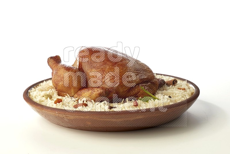 white  basmati Rice with  whole roasted chicken    on a pottery plate  direct  on white background