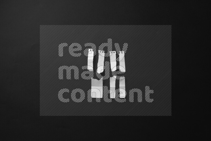 Ripped notebook sheet on black background