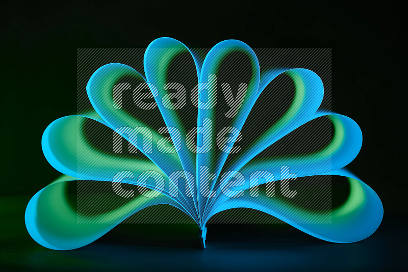 An abstract art piece displaying smooth curves in blue and green gradients created by colored light