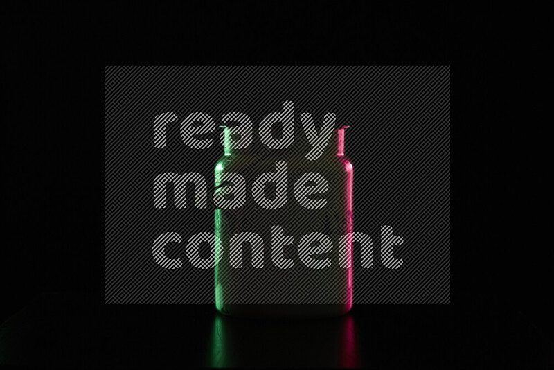 A vintage milk canister with colored rim light against black background