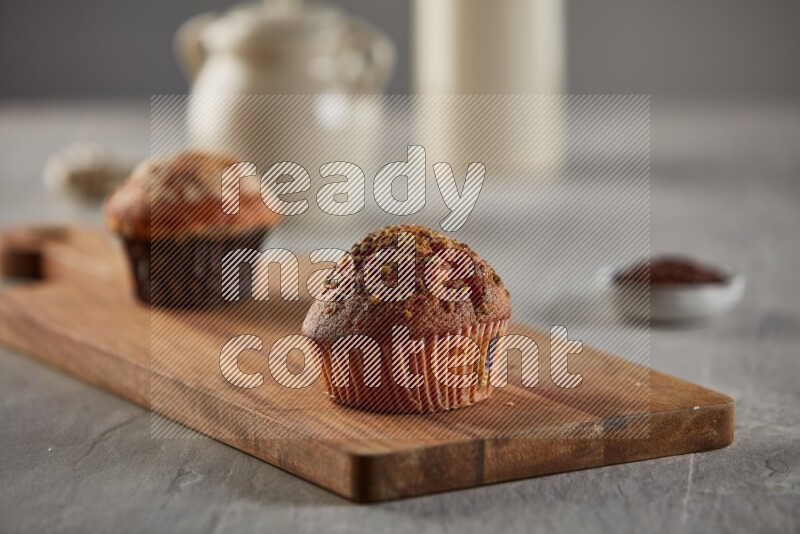 Pistachio cupcake on a wooden board