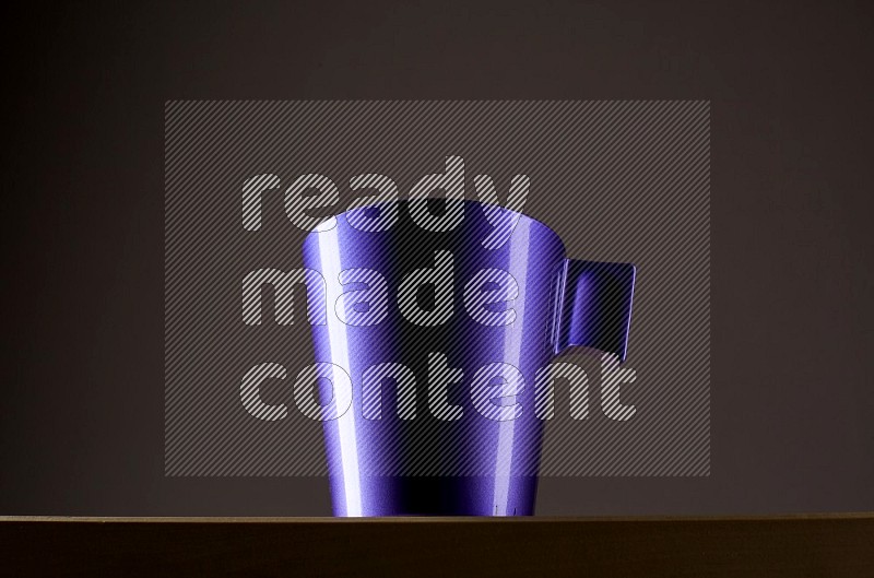 Low angle shot of a purple cup on grey background