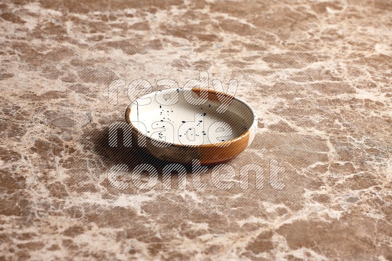 Multicolored Pottery Bowl on Beige Marble Flooring