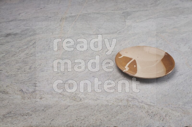 Multicolored Pottery Plate On Grey Marble Flooring