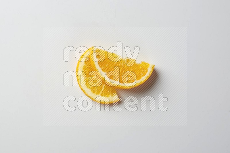 Two halves of an orange slices on white background