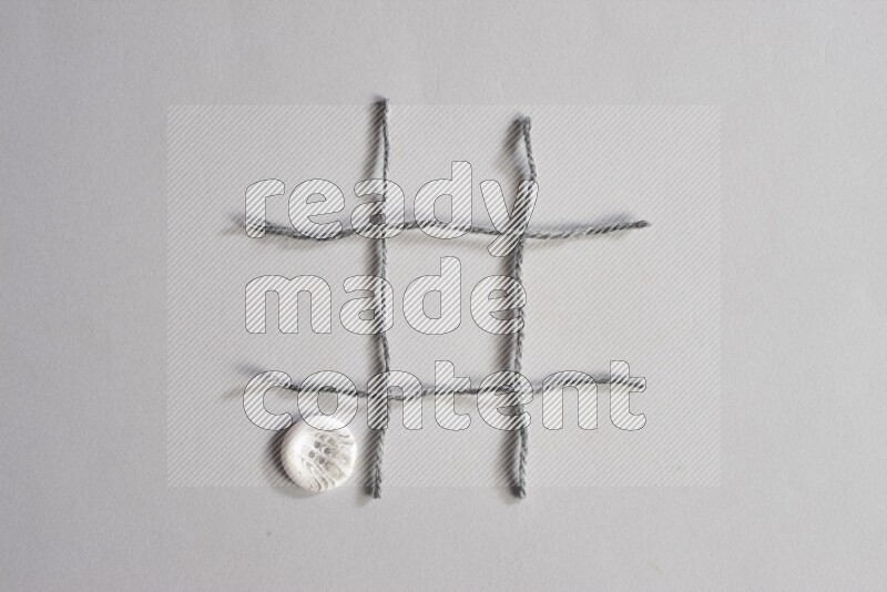 White buttons placed on grey background