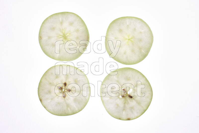 Apple slices on illuminated white background