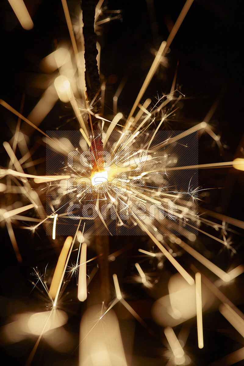 A close-up image of sparkler candle isolated on black background