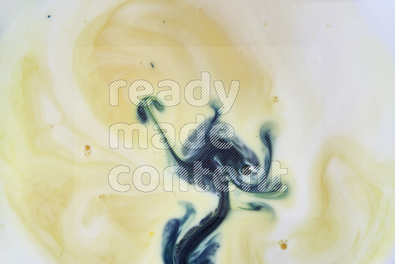 A close-up of abstract swirling patterns in yellow and green