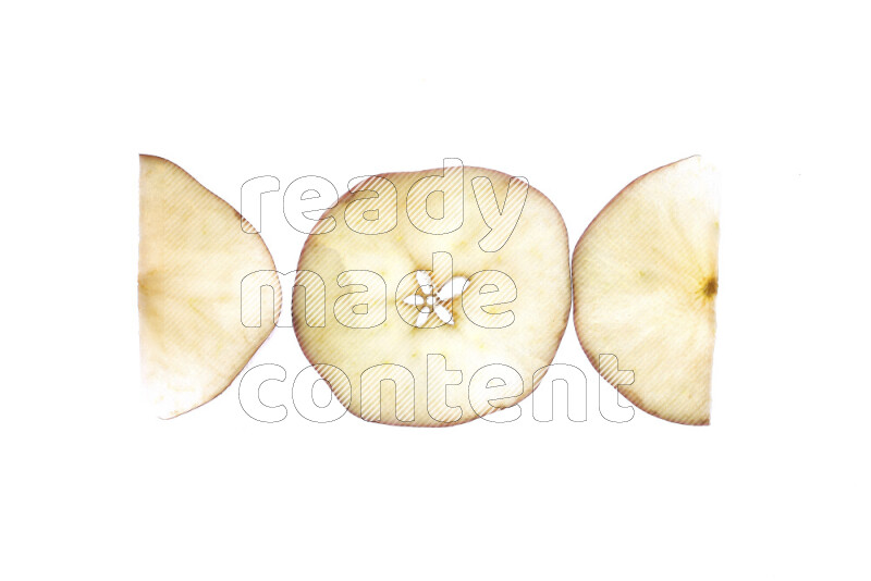 Apple slices on illuminated white background