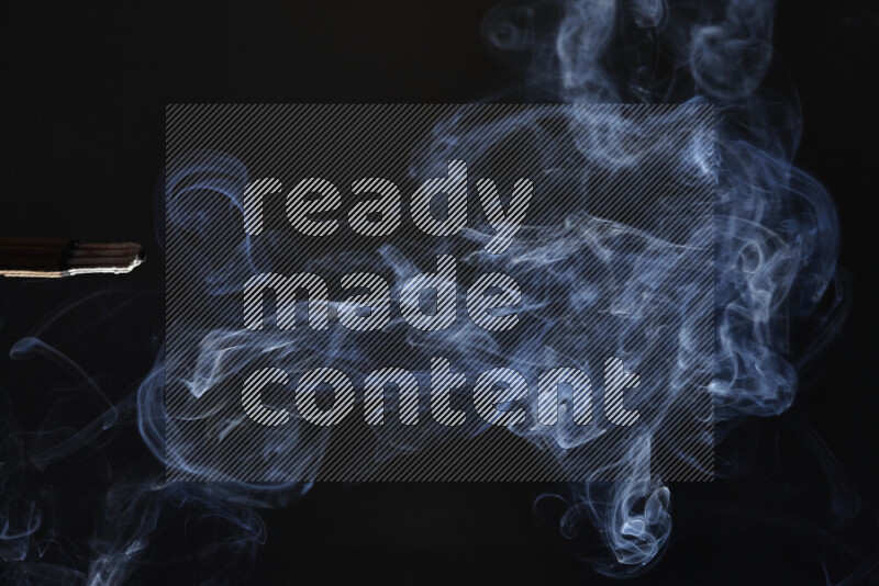 Motion of wavy smoke isolated on dark background
